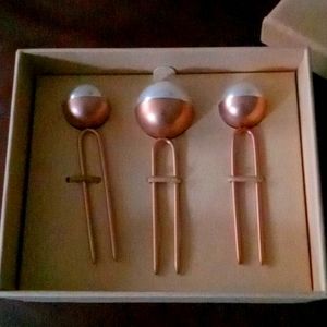 Woman's hair pins.  Beautiful!  Rose gold color with white top.  2 small,1 large